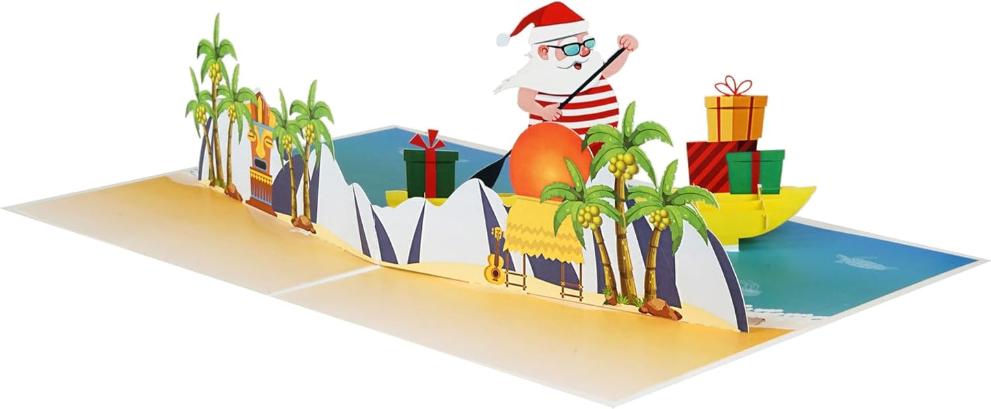 iGifts And Cards Tropical Santa 3D Pop Up Christmas Card - Warm Wishes from Down Under! Funny Beach Holiday Greeting with Santa Rowing a Canoe Full of Gifts – 6" x 8" with Notecard and Envelope